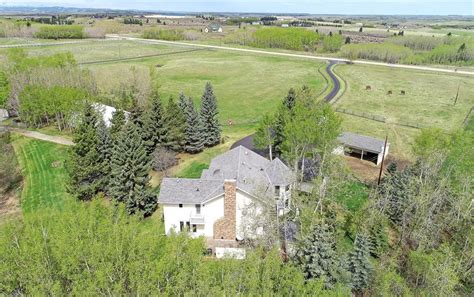 Only 20 minutes from Calgarys downtown core, this grand artfully designed Church Ranches estate boasting nearly 10,000 sq ft of living space and its own private lake impresses at. . Acreages for sale calgary